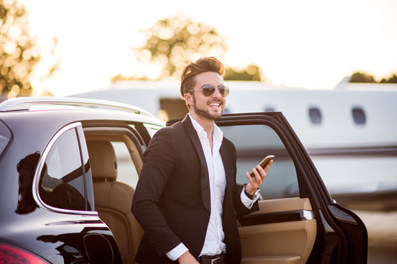 Gentle man leaving a luxurious limo